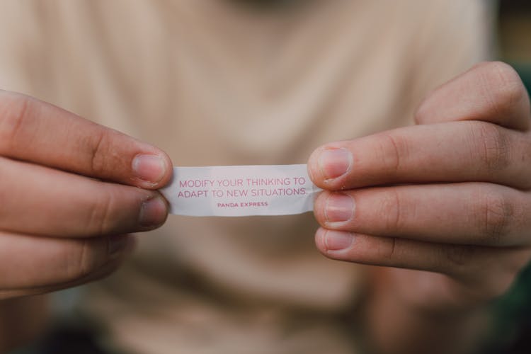 A Person Holding A Paper