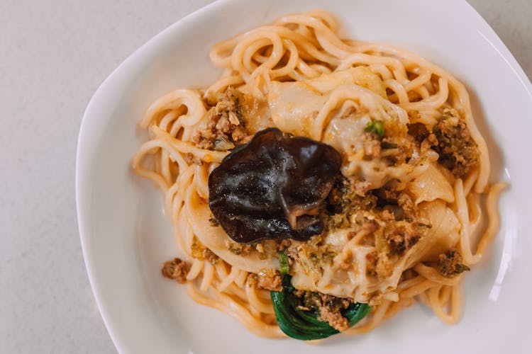 White Creamy Pasta Sauce On Ceramic Plate