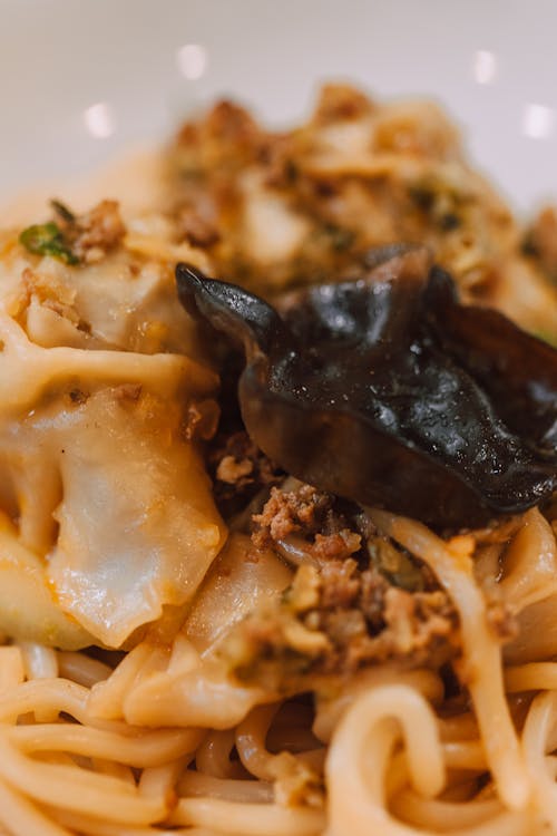 Close-up Shot of Creamy Pasta with Champignon Topping