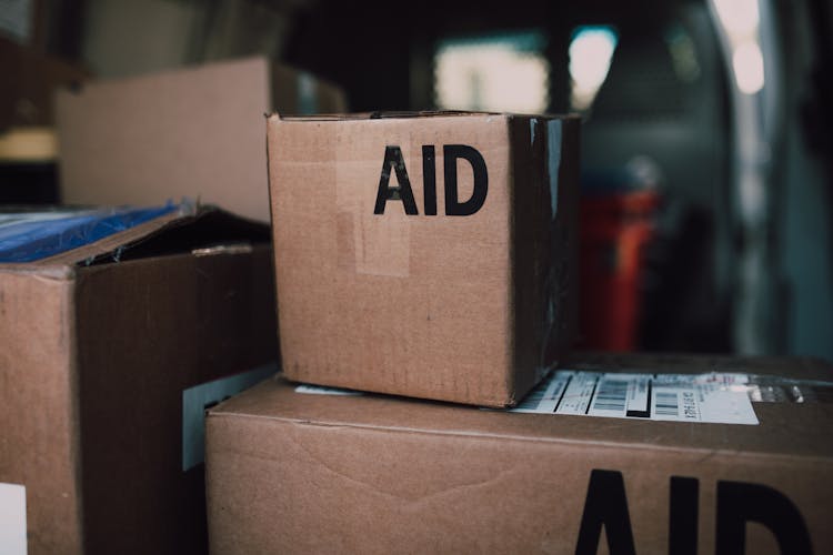 A Brown Cardboard Box With Aid Label