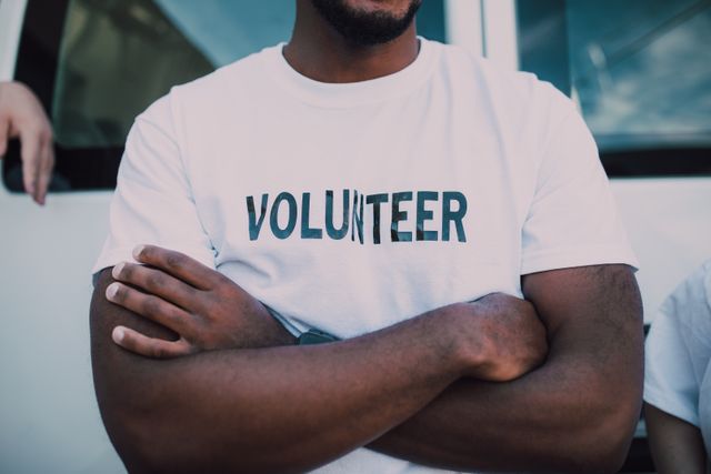 Community volunteer wearing a volunteer T-shirt