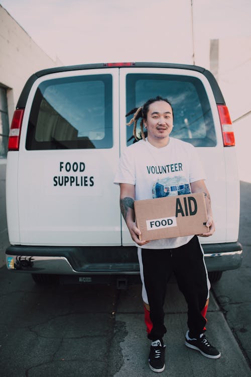 Gratis lagerfoto af asiatisk mand, boks, donation