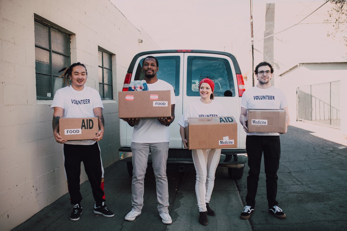 Volunteer handing food supplies to a family