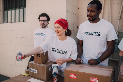 Three People Donating Goods