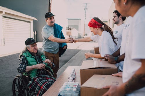 Free 
Volunteers Giving Donations Stock Photo