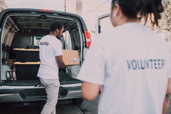 Volunteers distributing food to community