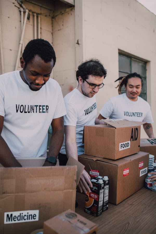 Group preparing food and medicine boxes