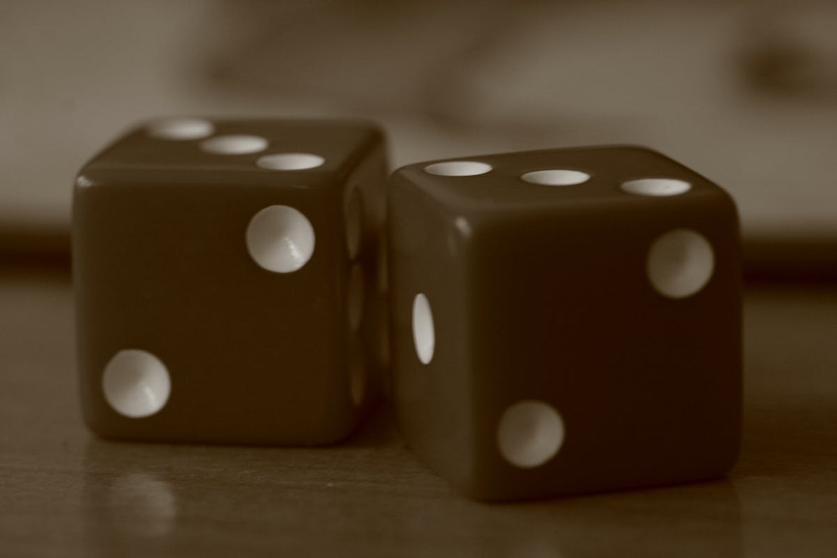 Content creator filming a product video at a desk with lighting and camera equipment