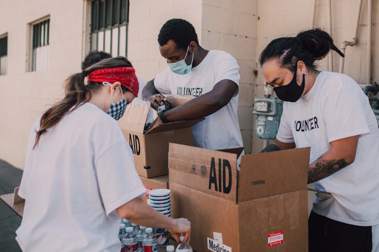 A Group Of Volunteers Boxing Relief Good