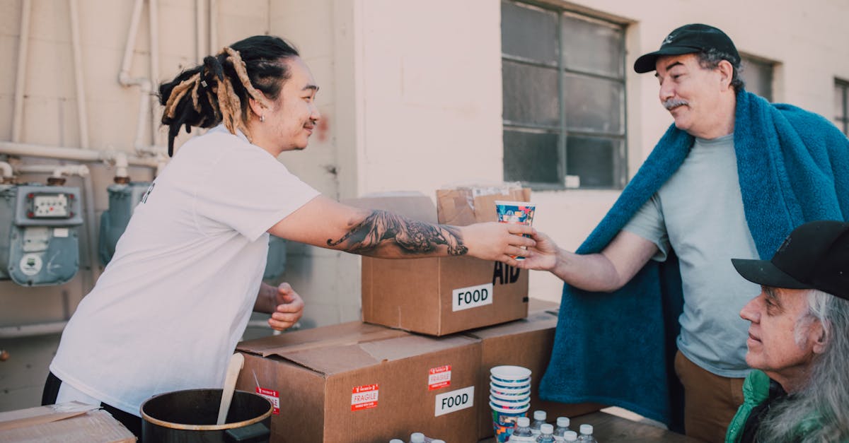 Photo by RDNE Stock project Volunteers distribute food and aid packages to those in need, fostering community support.