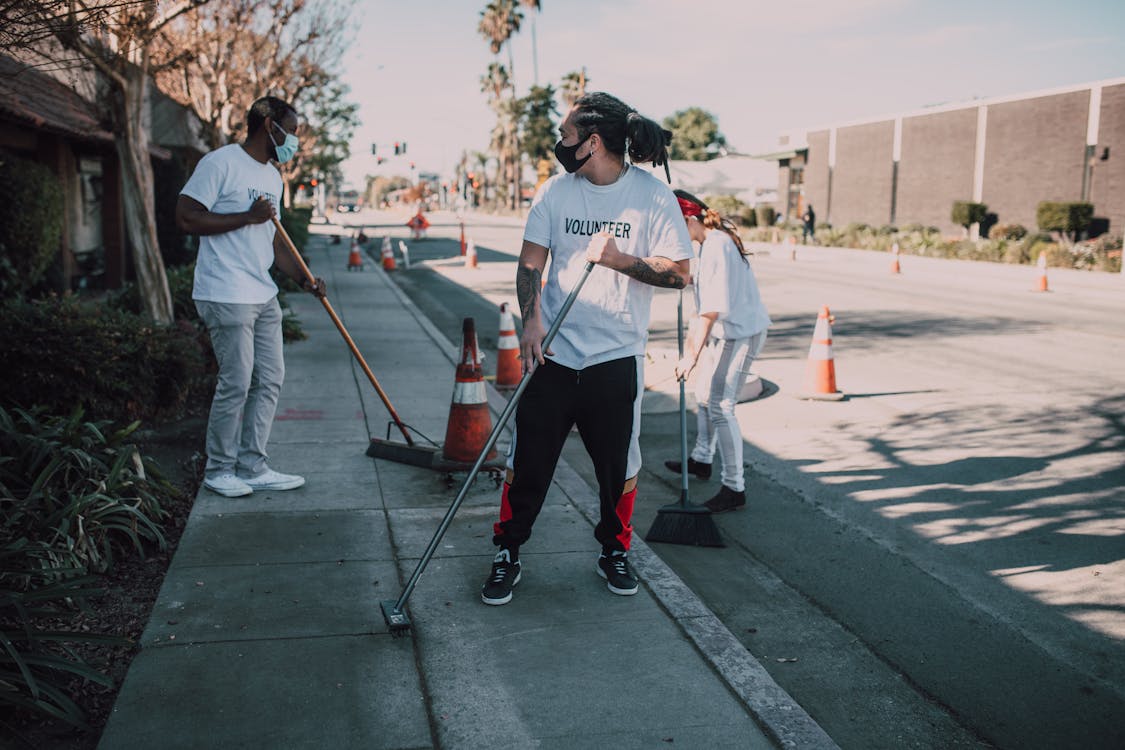 Free Volunteers Cleaning the Street Stock Photo