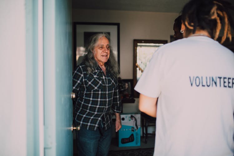 Person Opening The Door For The Volunteers