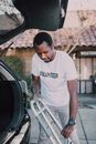 Man Putting the Walker in the Car Trunk