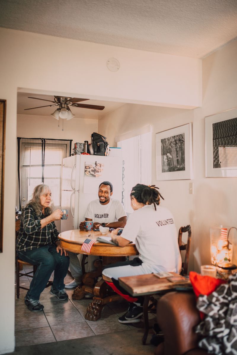 Volunteers sharing a meal together indoors