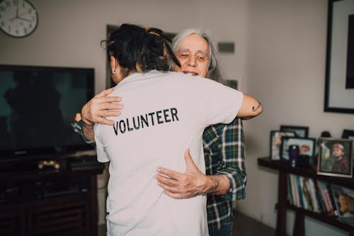 Two People Hugging Each Other