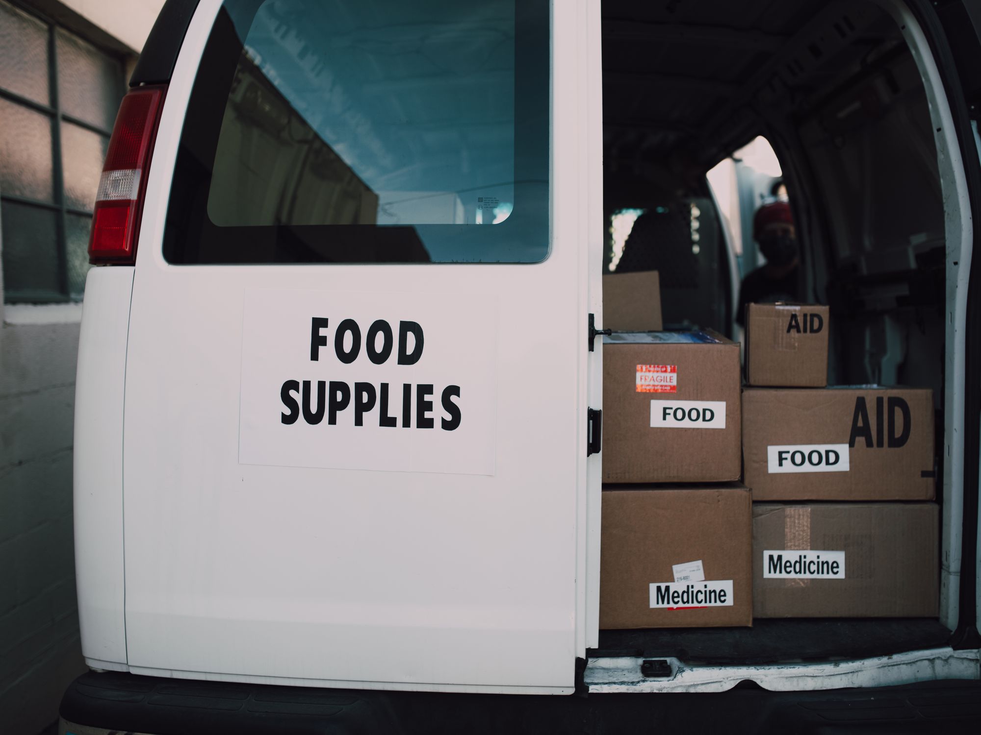 Furniture & Delivery in Fochabers, Scotland — movers delivering furniture from a van