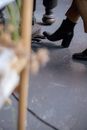 Unrecognizable woman pressing leg on piano pedal while playing