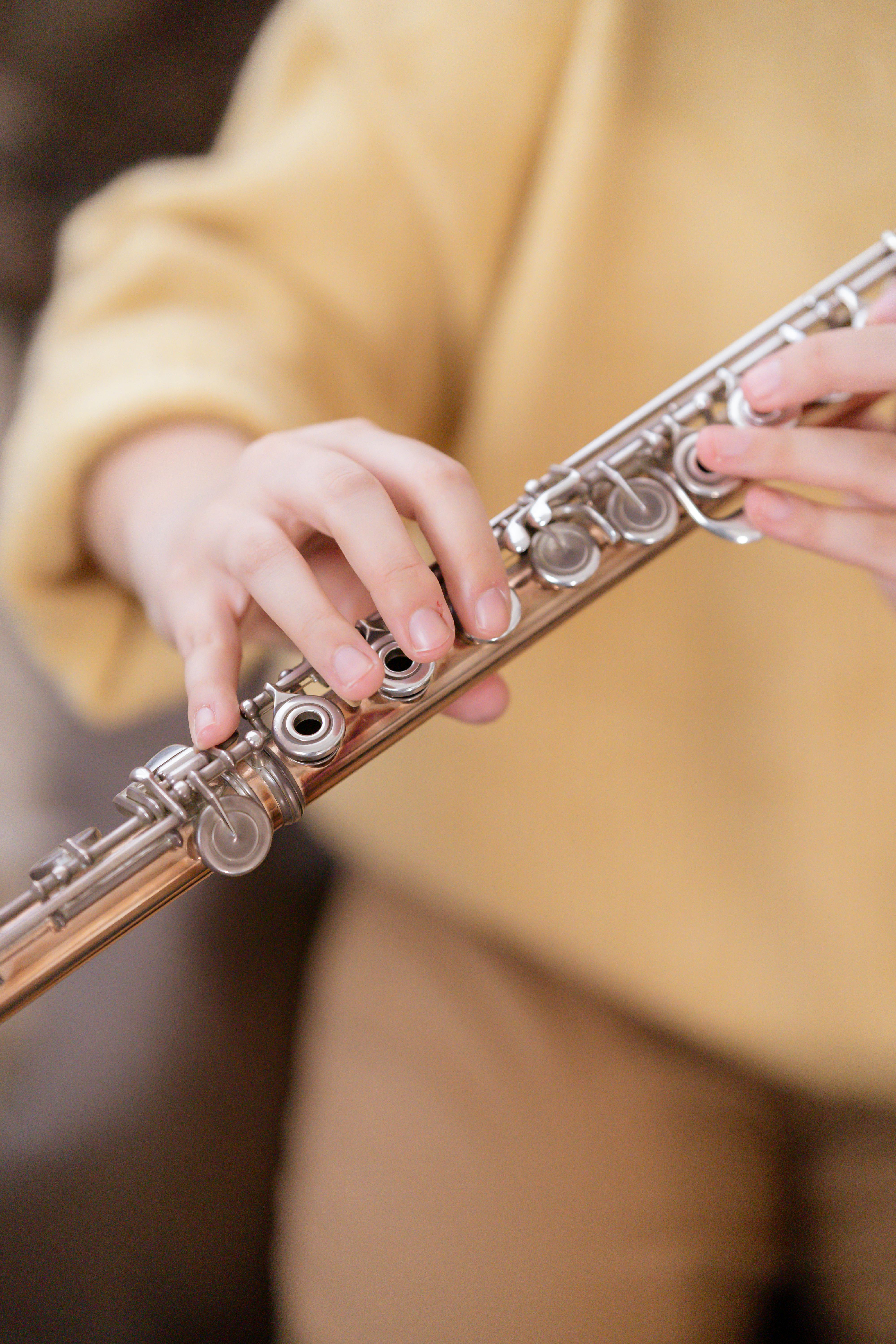 woman demonstrating professional flute in hands