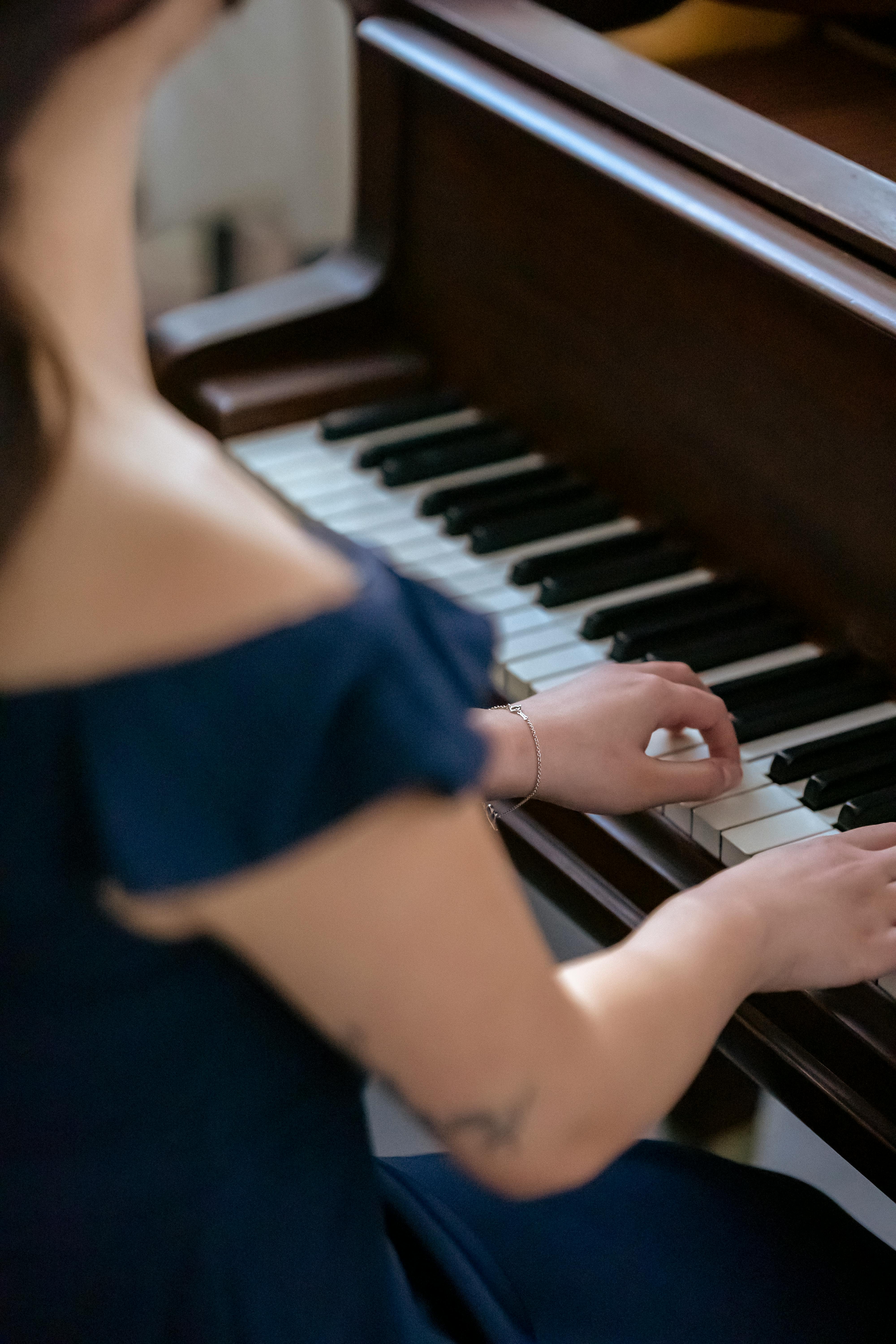 anonymous elegant musician playing piano