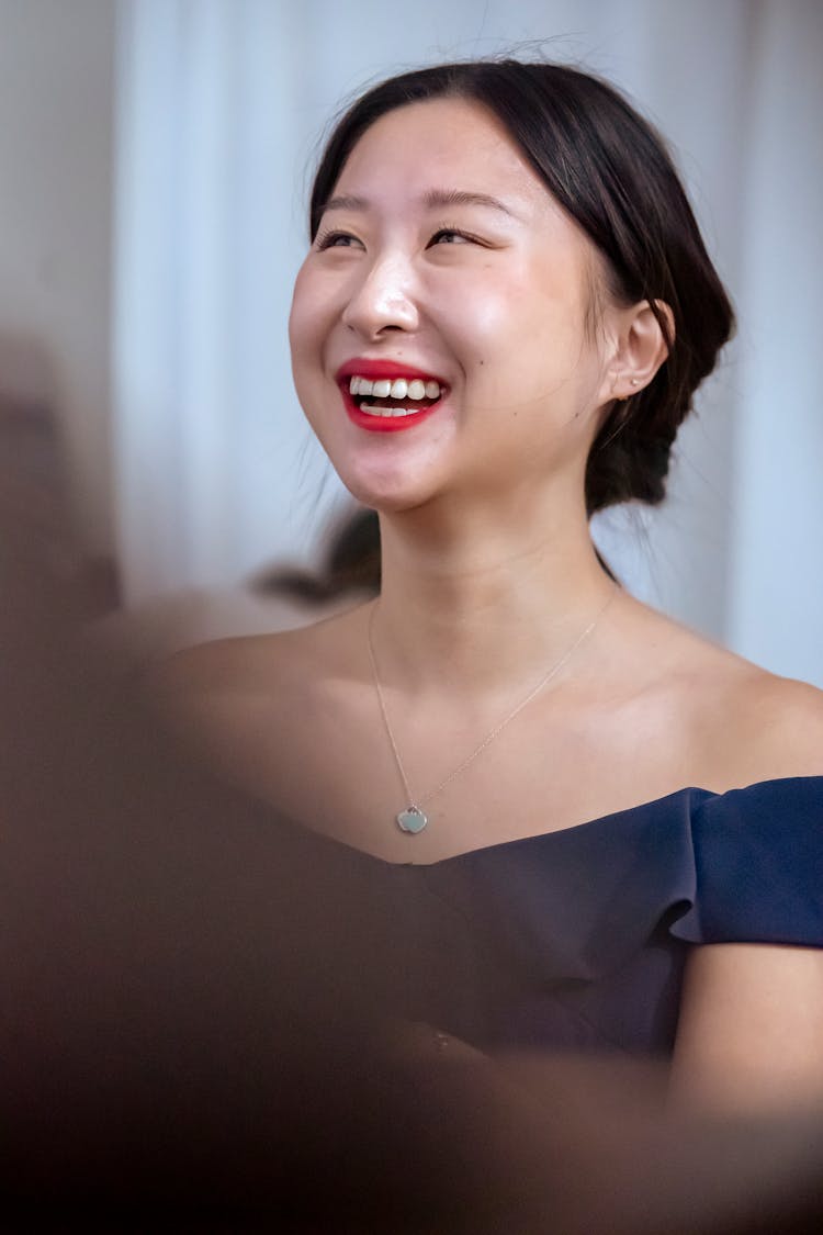 Smiling Asian Woman With Red Lips In Dress