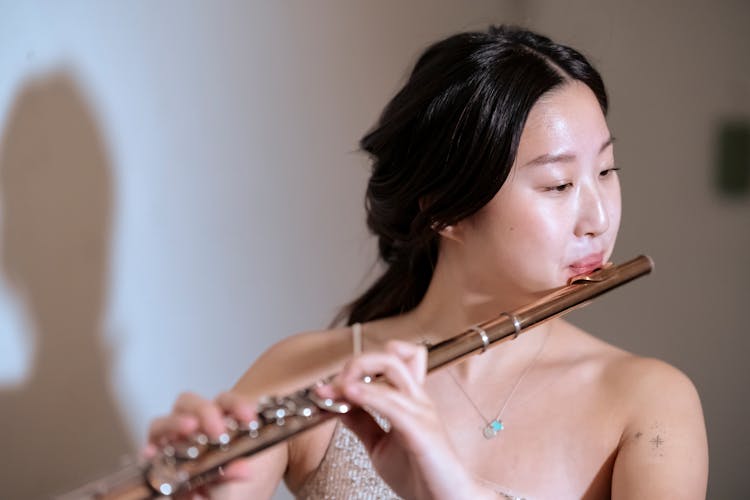 Ethnic Musician With Flute Performing On Stage