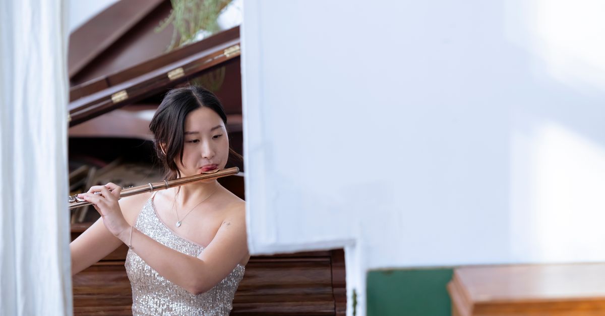 A split image showing a classical composer at a piano on one side, and glowing, flowing data visualizations representing AI algorithms on the other