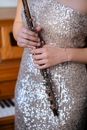 Woman in elegant apparel holding flute