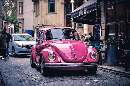 Free Pink Car Parked on the Street Stock Photo