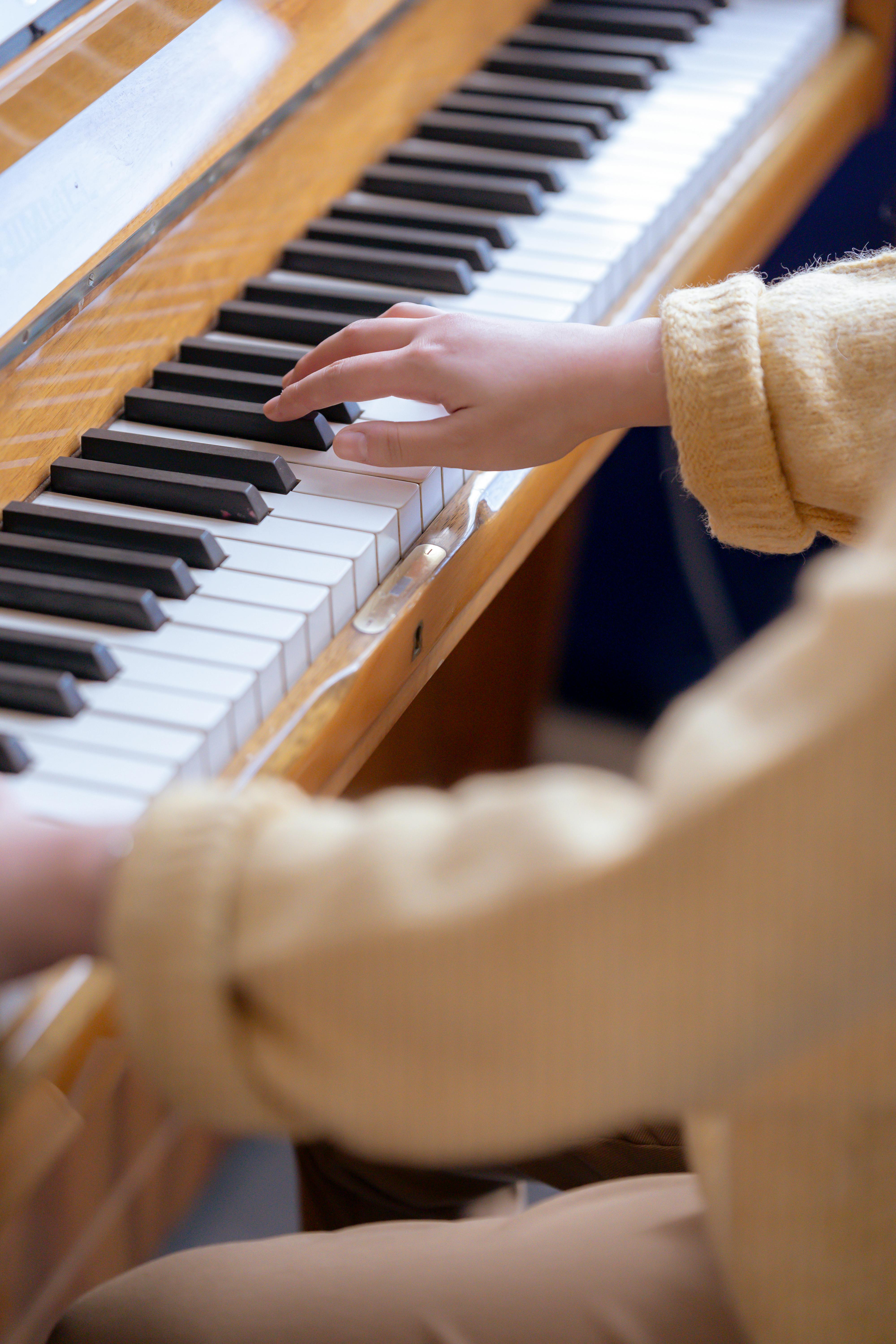 woman playing piano and practicing symphony