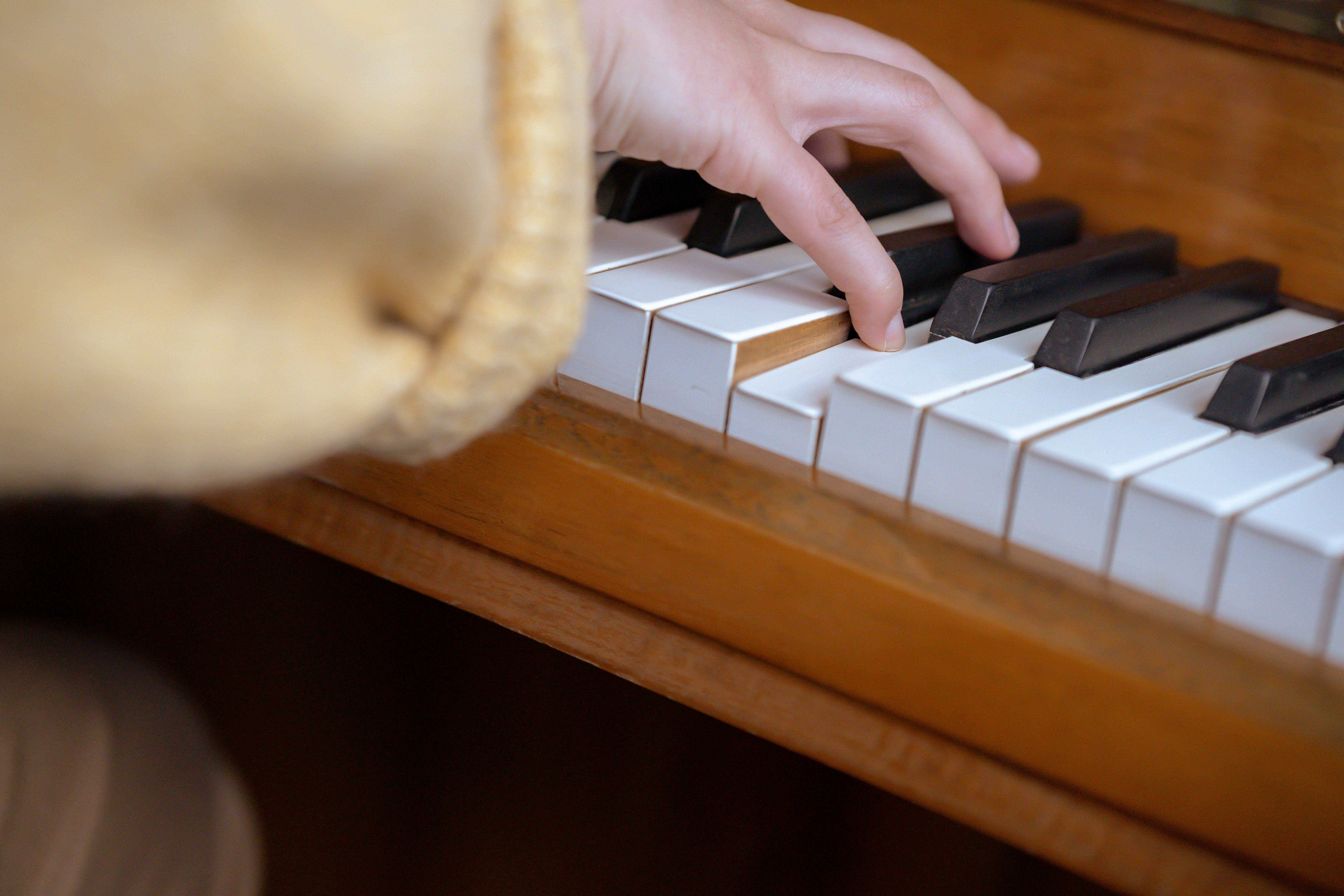 female musician playing piano in studio