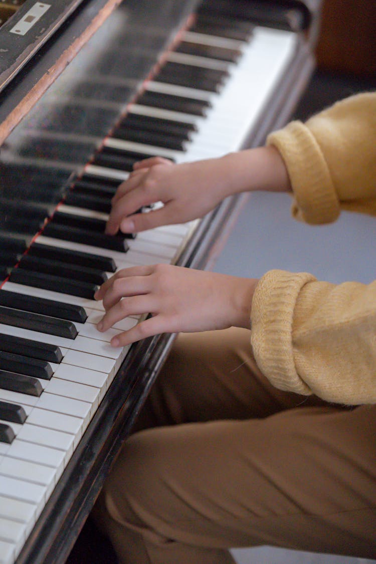 Anonymous Woman Playing Piano In Studio