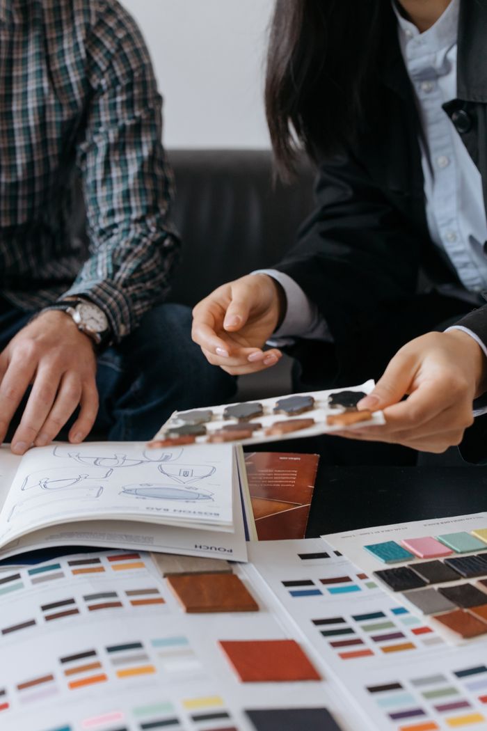 Two people discussing colour swatches, cottonbro studio on Pexels