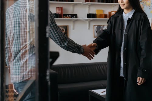 Close-up Photo of People doing Handshakes