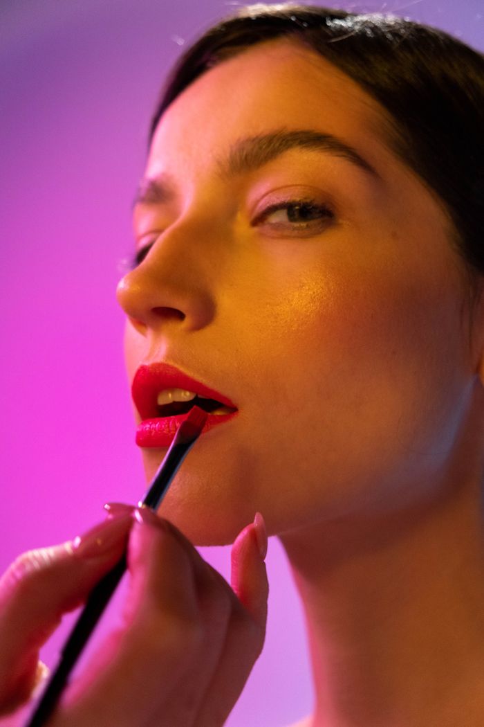 Lip tint brushed on during a lip blush session