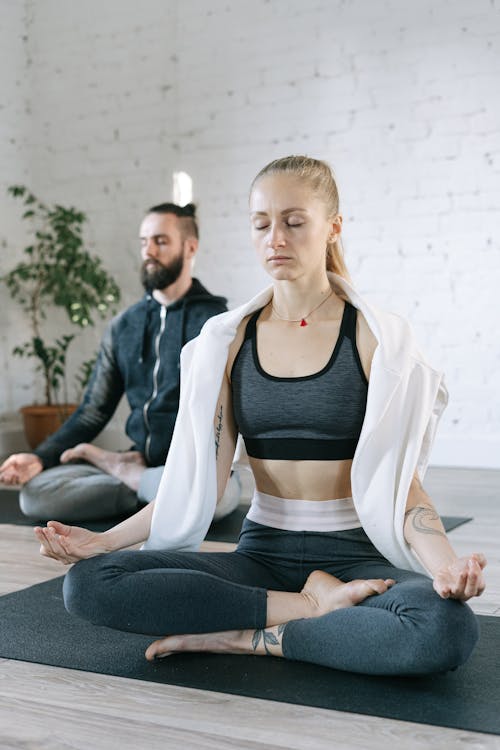 Free A  Man and a Woman Meditating Stock Photo