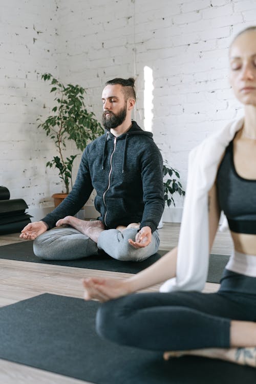 A Man and a Woman in Lotus Pose