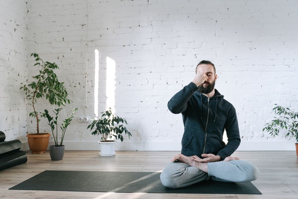 Woman practising restorative yoga for anxiety relief