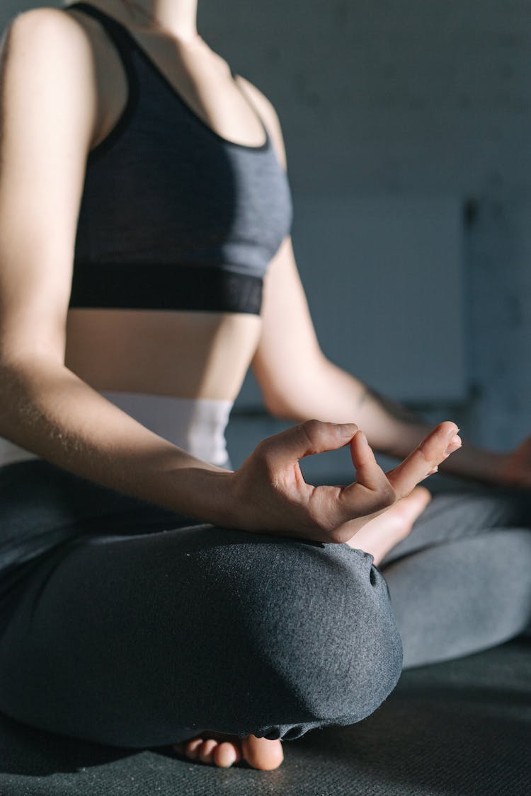 Woman Sitting In Yoga Position