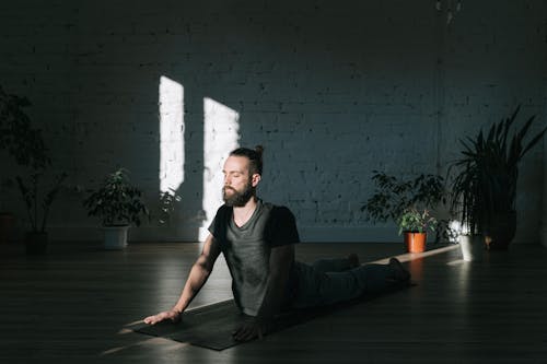 A Man Meditating Inside a Studio