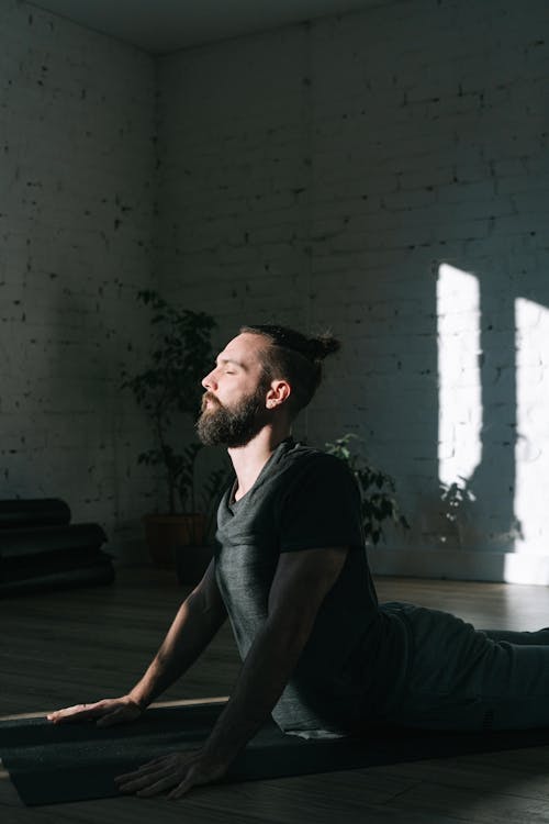 Man in Black Shirt Doing Yoga