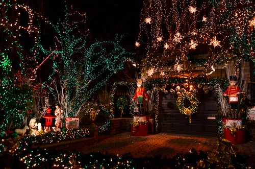 Free A vibrant Christmas lights display featuring decorations and nutcracker figures in a New York neighborhood. Stock Photo