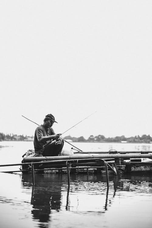 Free A Man Holding Fishing Rod Stock Photo