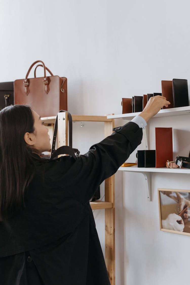 A Woman Looking Leather Wallets