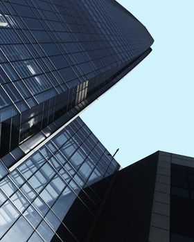 Low angle view of a modern skyscraper in Santiago, showcasing urban architecture.