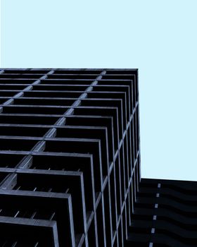 Low angle view of a modern minimalist building against a clear blue sky in Santiago.