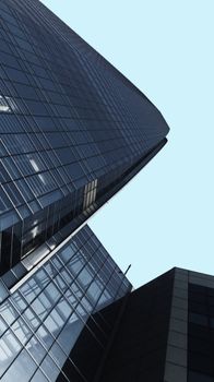 Low angle view of glass skyscrapers reflecting the sky in Santiago, Chile.