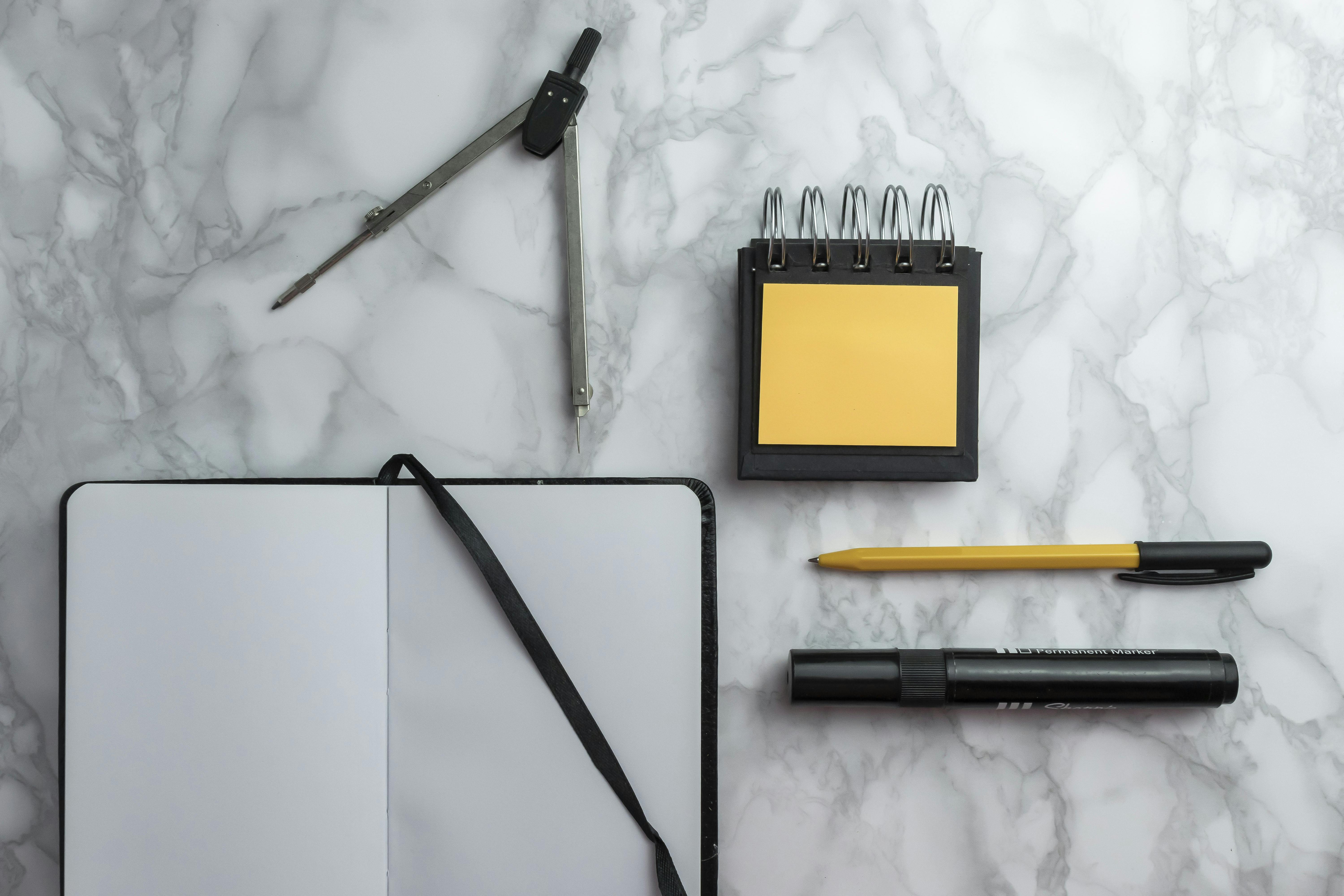 Notebook and sticky notes on desk for planning