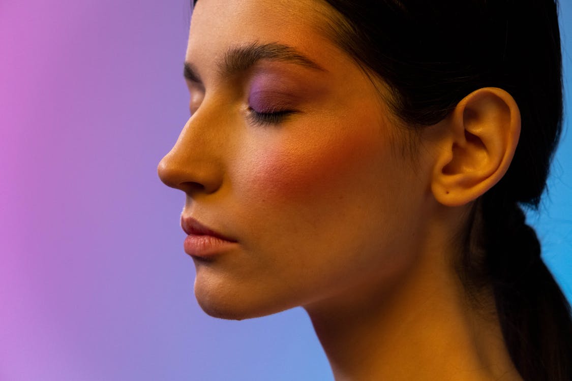 Free A Woman with a Blush On and and Eye Makeup Stock Photo
