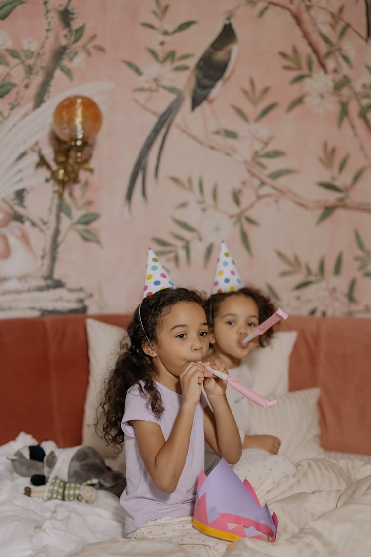 Children Blowing Party Horns