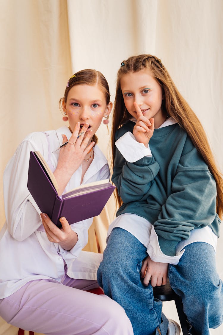 Girl Holding A Purple Notebook